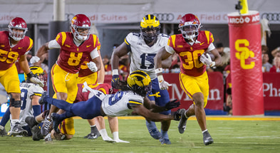 USC running back King Miller carries the ball during a game against the Michigan Wolverines