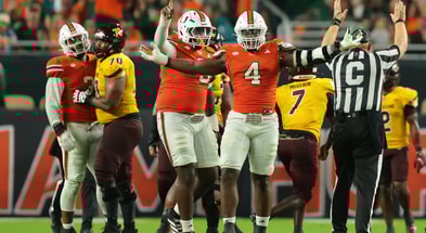 Sep 6, 2025; Miami Gardens, Florida, USA; Miami Hurricanes defensive lineman Rueben Bain Jr. (4) reacts after a sack against the Bethune-Cookman Wildcats during the third quarter at Hard Rock Stadium. Mandatory Credit: Sam Navarro-Imagn Images