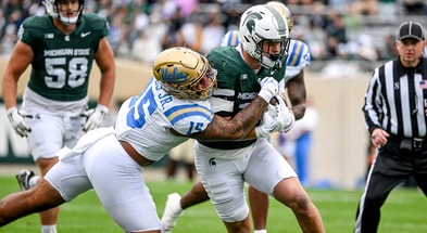 Michigan State's Jack Velling, right, runs after a catch as UCLA's Anthony Jones attempts the tackle during the first quarter on Saturday, Oct. 11, 2025, at Spartan Stadium in East Lansing. - Nick King, USA TODAY Sports