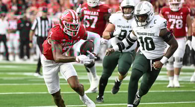 Indiana Hoosiers wide receiver E.J. Williams Jr. (7) runs after a catch past Michigan State Spartans linebacker Wayne Matthews (10) during the first half at Memorial Stadium. - Robert Goddin, USA TODAY Sports