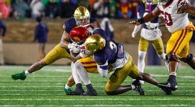 Notre Dame defenders Jaylen Sneed and Jordan Botelho USC