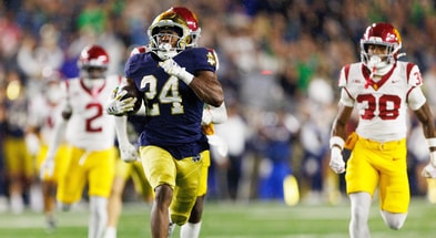 Notre Dame running back Jadarian Price (24) returns a kick for a touchdown in the second half of a NCAA football game against USC at Notre Dame Stadium on Saturday, Oct. 18, 2025, in South Bend