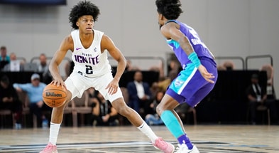 Dec 22, 2022; Las Vegas, NV, USA; NBA G League Ignite guard London Johnson (2) dribbles the ball against Greensboro Swarm guard Kobi Simmons (2) during the first half at Mandalay Bay Convention Center. Mandatory Credit: Lucas Peltier-Imagn Images