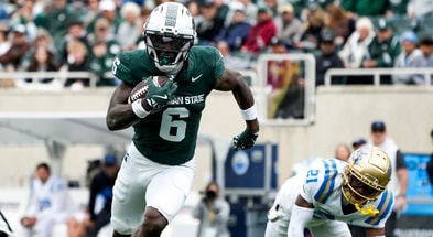 Michigan State wide receiver Nick Marsh (6) runs after catching the ball in the fourth quarter against the UCLA Bruins at Spartan Stadium. - Brendan Mullin, USA TODAY Sports