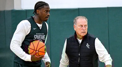 Michigan State's coach Tom Izzo, left, talks with Coen Carr, left, and Denham Wojcik during the first day of basketball practice on Monday, Sept. 22, 2025, at the Breslin Center in East Lansing. - Nick King, USA TODAY Sports