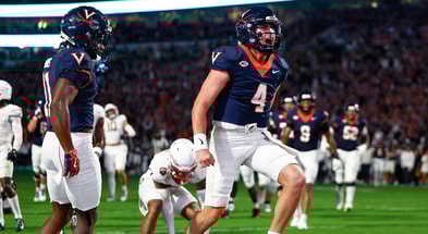 Virginia QB Chandler Morris celebrates a touchdown in the Cavaliers’ 2OT shootout against Florida State. (Geoff Burke / Imagn Images)