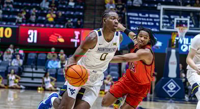 West Virginia forward Brenen Lorient drives to the basketball against Wheeling - Credit: WVSports.com