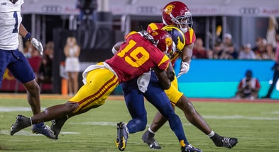 USC safety Bishop Fitzgerald makes a tackle against the Michigan Wolverines