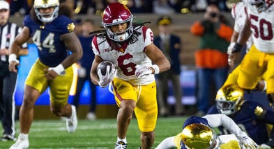 USC Trojans wide receiver Makai Lemon (6) breaks a tackle by Notre Dame Fighting Irish cornerback Leonard Moore (15) during the first half at Notre Dame Stadium
