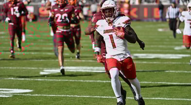 Nov 1, 2025; Blacksburg, Virginia, USA; Louisville Cardinals running back Isaac Brown (1) runs the ball for a touchdown against the Virginia Tech Hokies during the first quarter at Lane Stadium. Mandatory Credit: Brian Bishop-Imagn Images