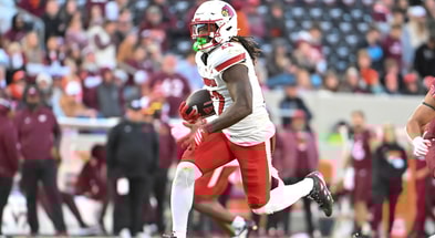Nov 1, 2025; Blacksburg, Virginia, USA; Louisville Cardinals running back Keyjuan Brown (22) runs the ball for a touchdown against the Virginia Tech Hokies during the fourth quarter at Lane Stadium. Mandatory Credit: Brian Bishop-Imagn Images