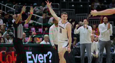 Jan 29, 2025; Coral Gables, Florida, USA; Virginia Cavaliers guard Isaac McKneely (11) reacts after scoring against the Miami Hurricanes during the second half at Watsco Center. Mandatory Credit: Sam Navarro-Imagn Images