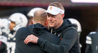 USC Trojans head coach Lincoln Riley and Nebraska Cornhuskers head coach Matt Rhule embrace before the game at Memorial Stadium