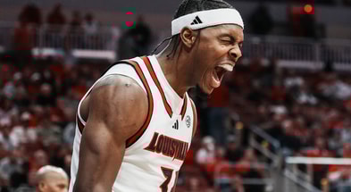 Louisville Cardinals guard Ryan Conwell (3) reacts after scoring two plus drawing the foul during the Cards' exhibition game against visiting Kansas at the KFC Yum! Center in Louisville, Kentucky Friday, October 24, 2025.