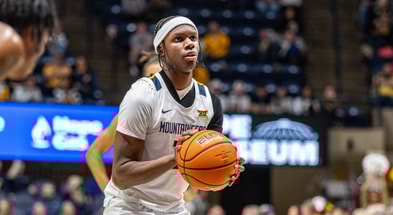 West Virginia guard Amir Jenkins shoots a free throw against Wheeling