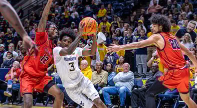 West Virginia guard Honor Huff drives against Wheeling