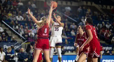 UConn Guard Azzi Fudd takes a shot against Louisville