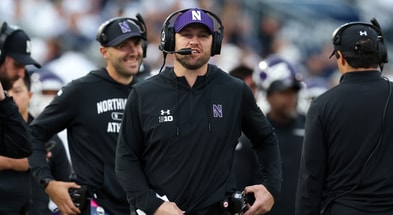 Northwestern Wildcats head coach David Braun walks on the sideline during the fourth quarter against the Penn State Nittany Lions at Beaver Stadium