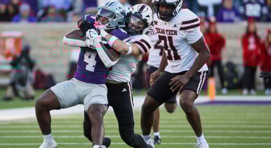 Nov 1, 2025; Manhattan, Kansas, USA; Kansas State Wildcats running back Joe Jackson (4) is tackled by Texas Tech Red Raiders linebacker John Curry (6) as linebacker David Bailey (31) watches the play during the fourth quarter at Bill Snyder Family Football Stadium.