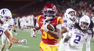 USC running back King Miller scores a touchdown against Northwestern