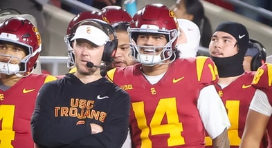 USC head coach Lincoln Riley and quarterback Jayden Maiava look on from the sideline during a game against Northwestern