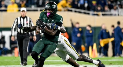 Michigan State's Elijah Tau-Tolliver runs for a gain against Michigan during the fourth quarter on Saturday, Oct. 25, 2025, at Spartan Stadium in East Lansing. - Nick King, USA TODAY Sports