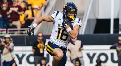 West Virginia wide receiver Jeff Weimer scores on the 75-yard pass from Scotty Fox.