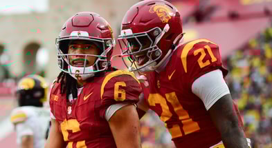 USC Trojans wide receiver Makai Lemon (6) celebrates his touchdown scored against the Iowa Hawkeyes with running back Bryan Jackson (21) during the second half at the Los Angeles Memorial Coliseum