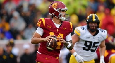 USC Trojans quarterback Jayden Maiava (14) moves out to pass against the Iowa Hawkeyes during the first half at the Los Angeles Memorial Coliseum
