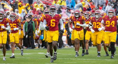 The USC Trojans take the field against the Iowa Hawkeyes