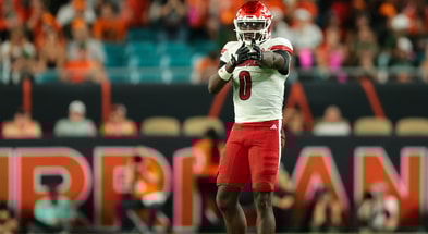 Oct 17, 2025; Miami Gardens, Florida, USA; Louisville Cardinals wide receiver Chris Bell (0) reacts after a carry against the Miami Hurricanes during the second quarter at Hard Rock Stadium. Mandatory Credit: Sam Navarro-Imagn Images