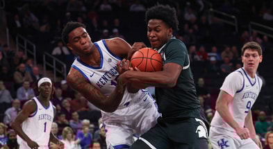Kentucky Wildcats forward Brandon Garrison (10) and Michigan State Spartans forward Cameron Ward (3) battle for a rebound during the first half at Madison Square Garden. - Vincent Carchietta, USA TODAY Sports