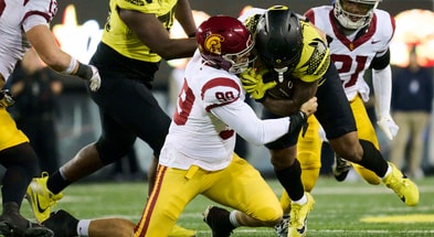 USC Trojans defensive lineman Jack Sullivan (99) tackles Oregon Ducks running back Jordan James (20) during the second half at Autzen Stadium