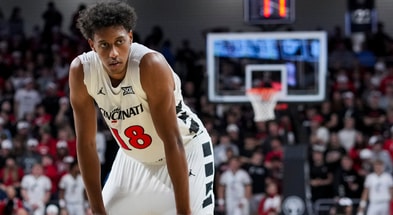 Nov 11, 2025; Cincinnati, Ohio, USA; Cincinnati Bearcats forward Baba Miller (18) stands on the court against the Dayton Flyers in the second half at Fifth Third Arena. Mandatory Credit: Aaron Doster-Imagn Images