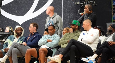 July 19, 2025; North Augusta, South Carolina, USA; NBA star Carmelo Anthony (center right) talks to University of Kentucky basketball coach Mark Pope (right) during the Team Why Not and Team CP3 game at the Nike EYBL Peach Jam at Riverview Park Activity Center. Team Why Not won 66-63. Mandatory Credit: Katie Goodale - Augusta Chronicle/USA TODAY NETWORK