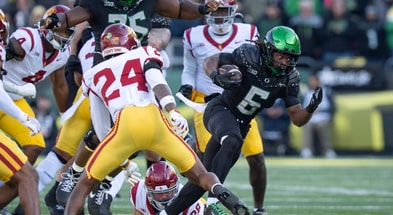 Oregon running back Noah Whittington carries the ball as the Oregon Ducks host the USC Trojans on Nov. 22, 2025, at Autzen Stadium in Eugene, Oregon