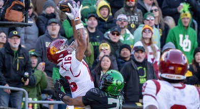 USC wide receiver Tanook Hines hauls in a touchdown pass under cover from Oregon defensive back Aaron Flowers as the Oregon Ducks host the USC Trojans on Nov. 22, 2025, at Autzen Stadium in Eugene, Oregon