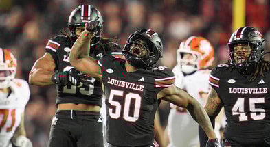 Louisville Cardinals defensive lineman Clev Lubin (50) celebrates his tackle of Clemson Tigers quarterback Cade Klubnik (2) in the first half at L&N Stadium Friday, Nov. 14, 2025. (© Matt Stone/Courier Journal / USA TODAY NETWORK via Imagn Images)