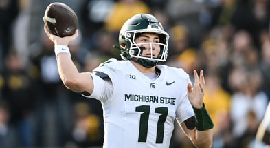 Nov 22, 2025; Iowa City, Iowa, USA; Michigan State Spartans quarterback Alessio Milivojevic (11) throws a pass against the Iowa Hawkeyes during the first quarter at Kinnick Stadium. (© Jeffrey Becker-Imagn Images)