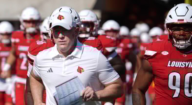 Louisville’s coach Jeff Brohm brings his team out onto the field against Virginia at L&N Stadium Saturday. Oct. 4, 2025. © Scott Utterback/Courier Journal / USA TODAY NETWORK via Imagn Images