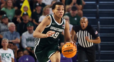 Michigan State Spartans guard Divine Ugochukwu (99) controls the ball against the East Carolina Pirates in the second half at Suncoast Credit Union Arena. - Nathan Ray Seebeck, USA TODAY Sports