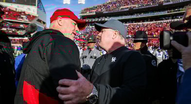 Louisville head coach Jeff Brohm congratulates Kentucky head coach Mark Stoops after the Wildcats beat Louisville 38-31 Saturday and retaining the Governor's Cup. It was Brohm's first Governor's Cup game as head coach for UofL. Nov. 24, 2023. © Matt Stone/The Courier Journal / USA TODAY NETWORK