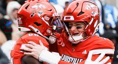 Louisville Cardinals tight end Jaleel Skinner (88) hugs Louisville Cardinals quarterback Miller Moss (7) after scoring a touchdown pass in the second half as the Cards dominated Kentucky 41-0 Saturday, November 29, 2025 in Louisville, Kentucky at L&N Federal Credit Union Stadium.