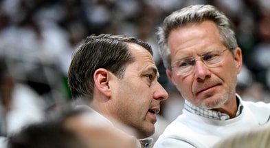 Michigan State Athletic Director J Batt, left, talks with MSU President Kevin Guskiewicz during the Spartans men's basketball game against Arkansas on Saturday, Nov. 8, 2025, at the Breslin Center. - Nick King, USA TODAY Sports