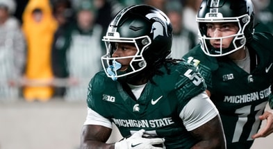 Michigan State quarterback Alessio Milivojevic (11) hands the ball off to Michigan State running back Makhi Frazier (5) against Penn State in the third quarter at Spartan Stadium. - Brendan Mullin, USA TODAY Sports