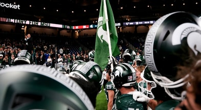 Michigan State players sing the Michigan State fight song after defeating Maryland at Ford Field. - Brendan Mullin, USA TODAY Sports