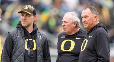 Oregon offensive coordinator Will Stein, left, former Oregon defensive coordinator Nick Aliotti and former Oregon coach Rich Brooks talk before the game as the Fighting Ducks face off against Mighty Oregon in the Oregon Ducks spring game on April 26, 2025, at Autzen Stadium in Eugene. (© Ben Lonergan/The Register-Guard / USA TODAY NETWORK via Imagn Images)
