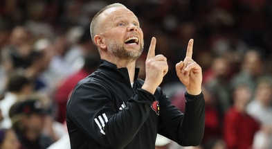 Dec 3, 2025; Fayetteville, Arkansas, USA; Louisville Cardinals head coach Pat Kelsey during the first half against the Arkansas Razorbacks at Bud Walton Arena. Mandatory Credit: Nelson Chenault-Imagn Images