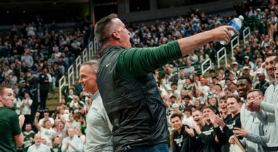 Michigan State's new football coach Pat Fitzgerald hypes up the Izzone before the Spartans basketball game against Iowa on Tuesday, Dec. 2, 2025, at the Breslin Center in East Lansing. - Nick King, USA TODAY Sports
