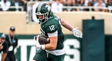 Michigan State's Jack Velling, left, catches a pass as Youngstown State's Isaiah Hackett defends during the third quarter on Saturday, Sept. 13, 2025, at Spartan Stadium in East Lansing. - Nick King, USA TODAY Sports